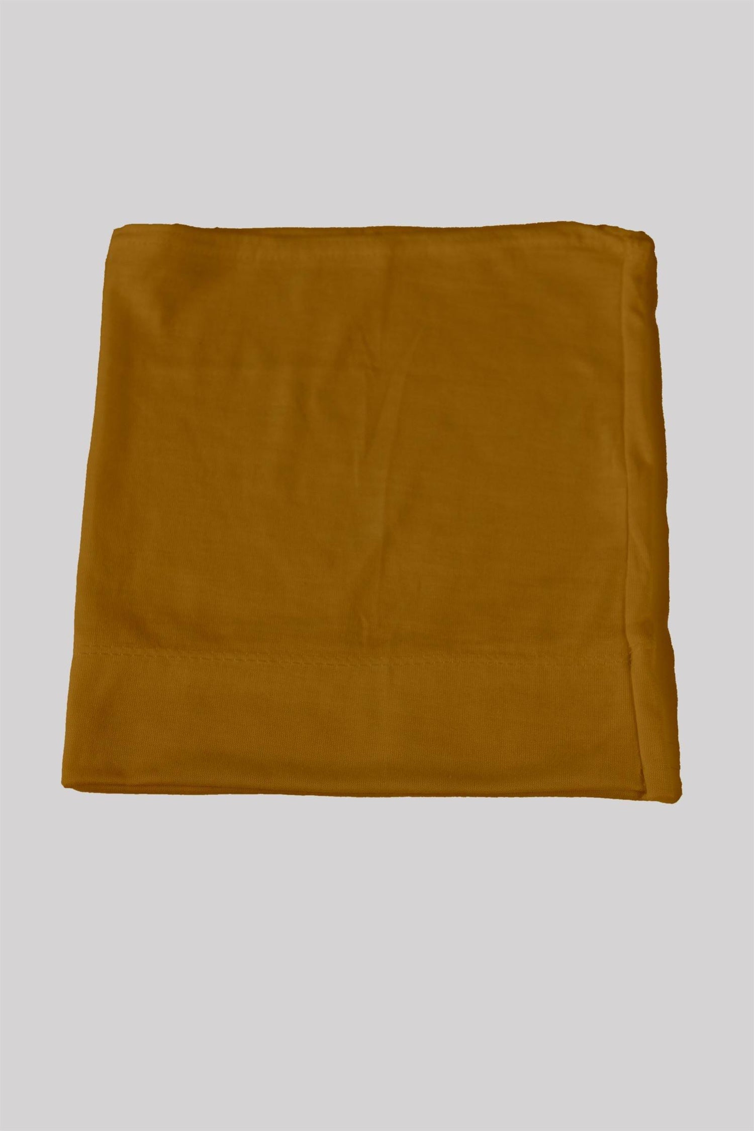 Everyday Soft Tube Cap in Mustard color.