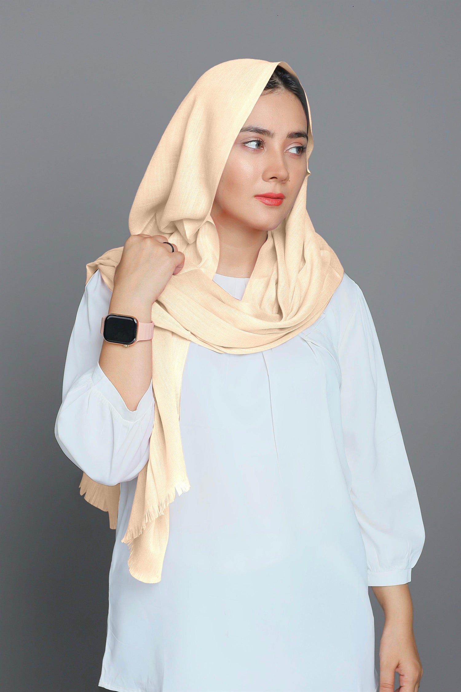 Model styling a Cream Hijab, capturing its elegant look and comfortable fit.