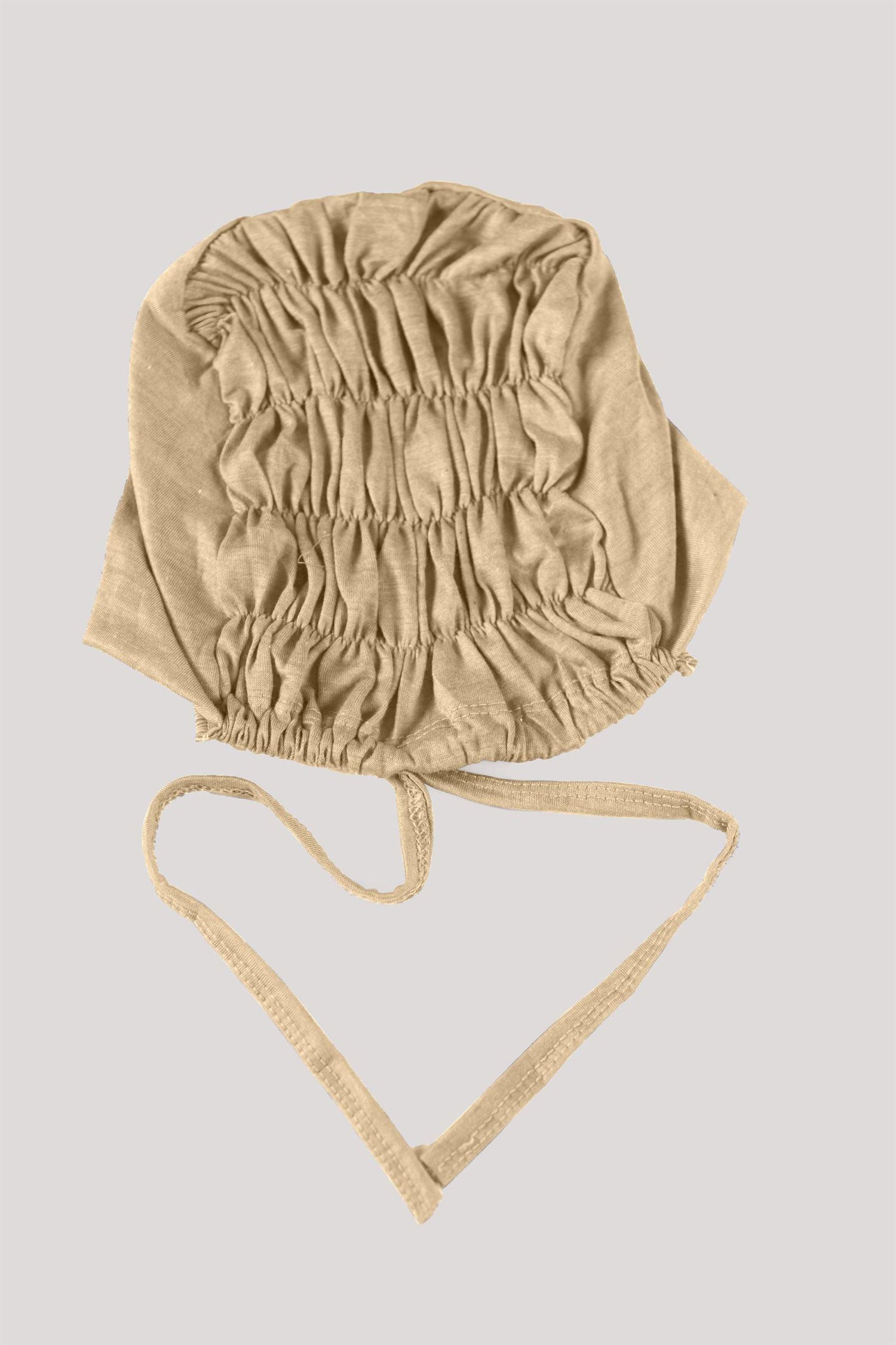 Stylish Fawn Ruched Hijab Cap featuring breathable material and subtle ruching.