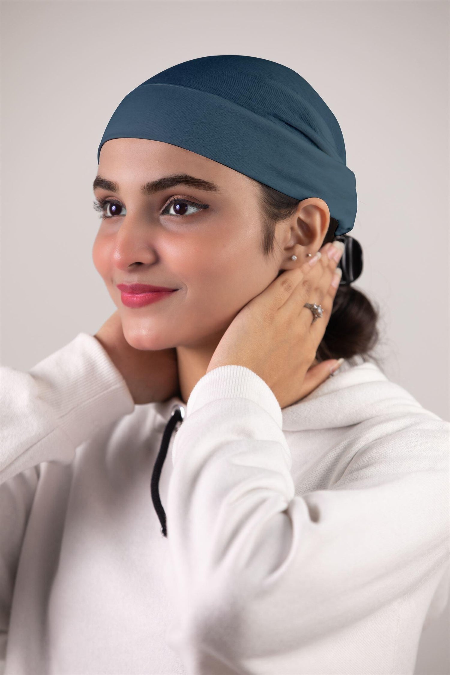 Girl Wearing Teal Blue Colored Soft Tube Hijab Cap.