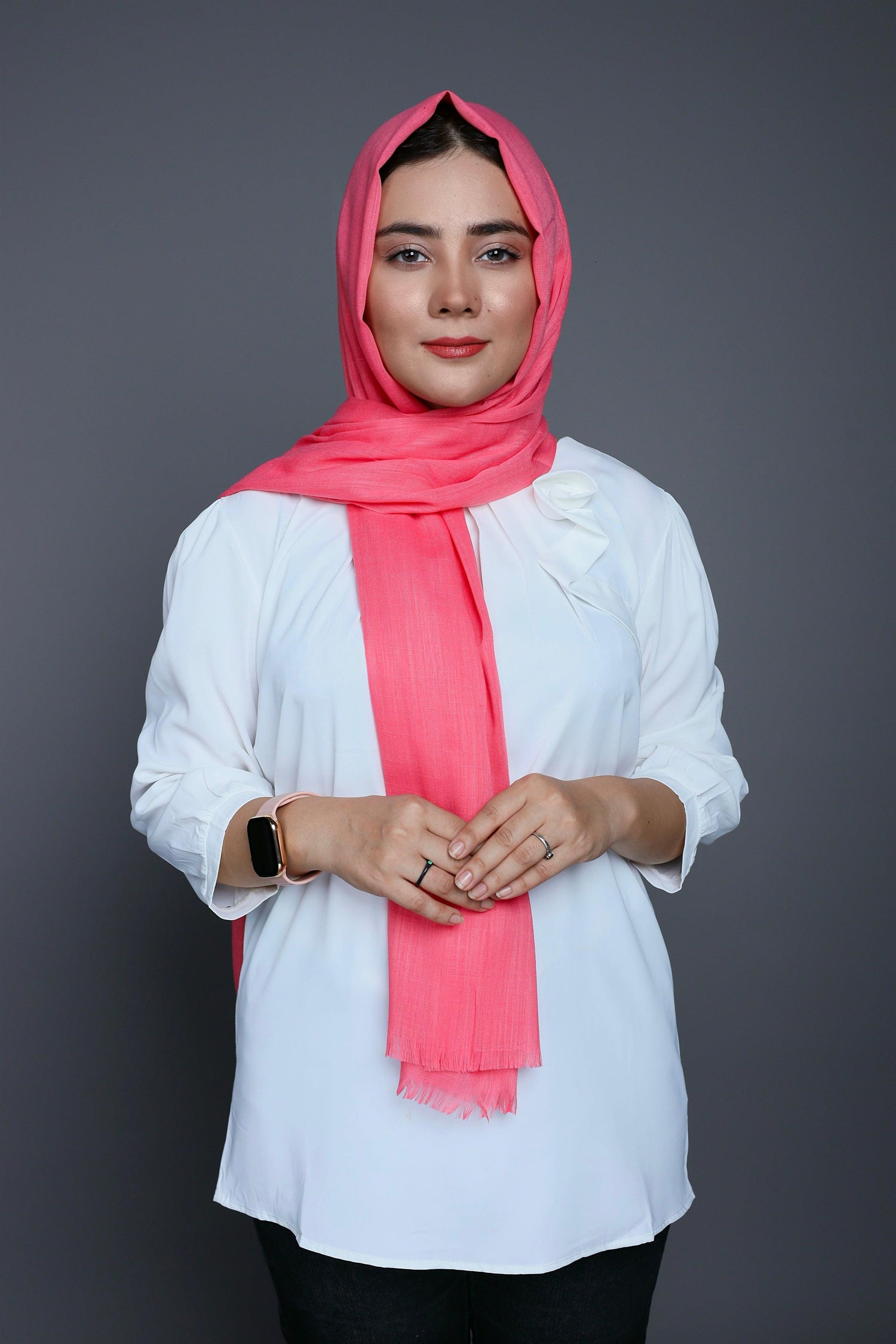 A woman wearing a soft Peach Quartz Turkish Hijab,