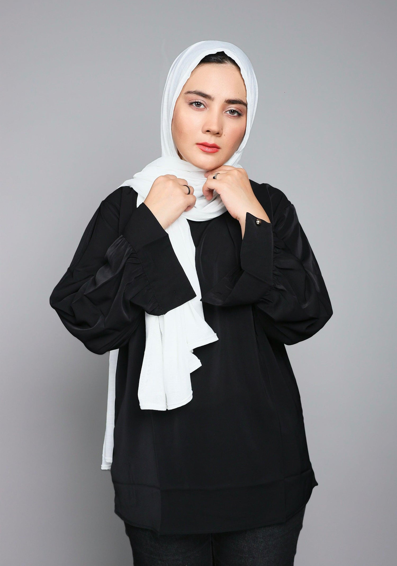 Girl Wearing Premium Jersey Hijab in white looking front.