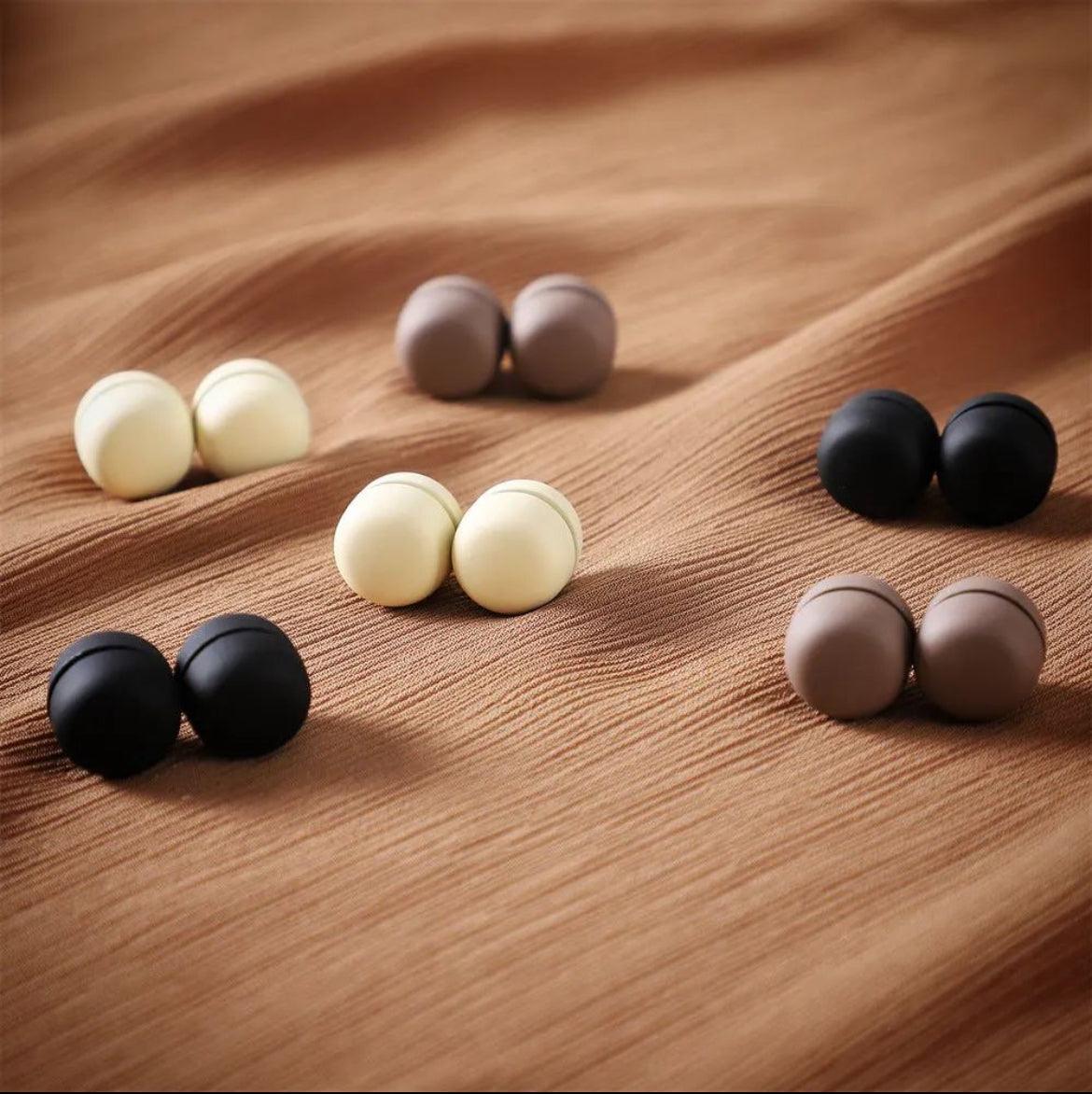 A stylish pair of matte black circular hijab magnets designed for a secure, no-snag hold that won’t damage fabric. Lightweight yet strong, they provide a smooth, slip-free fit, perfect for all-day comfort and effortless wear. Ideal for maintaining a sleek, pin-free look.