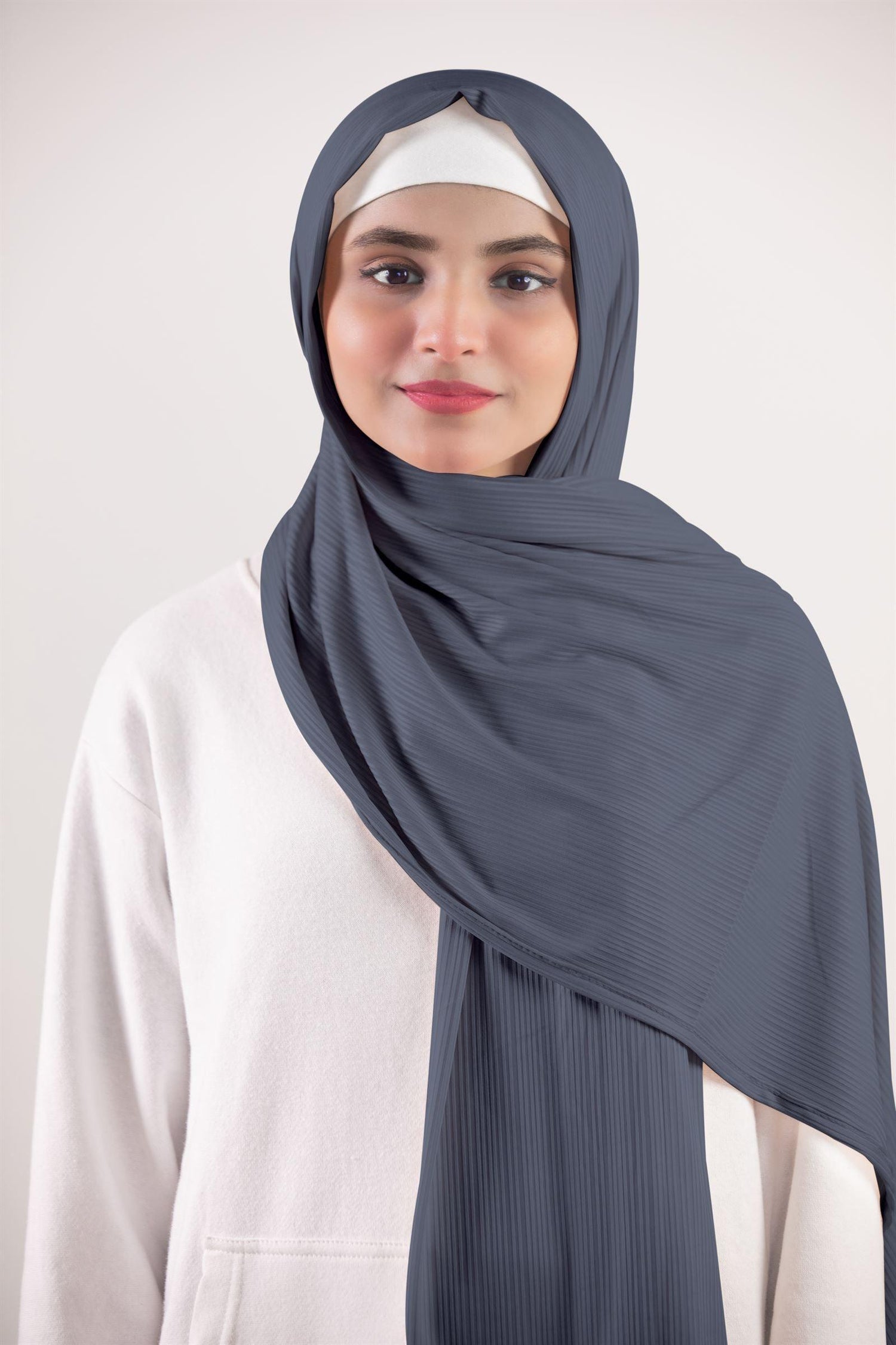 Ribbed Jersey Hijab. Woman Wearing Denim gray hijab made of ribbed jersey fabric.