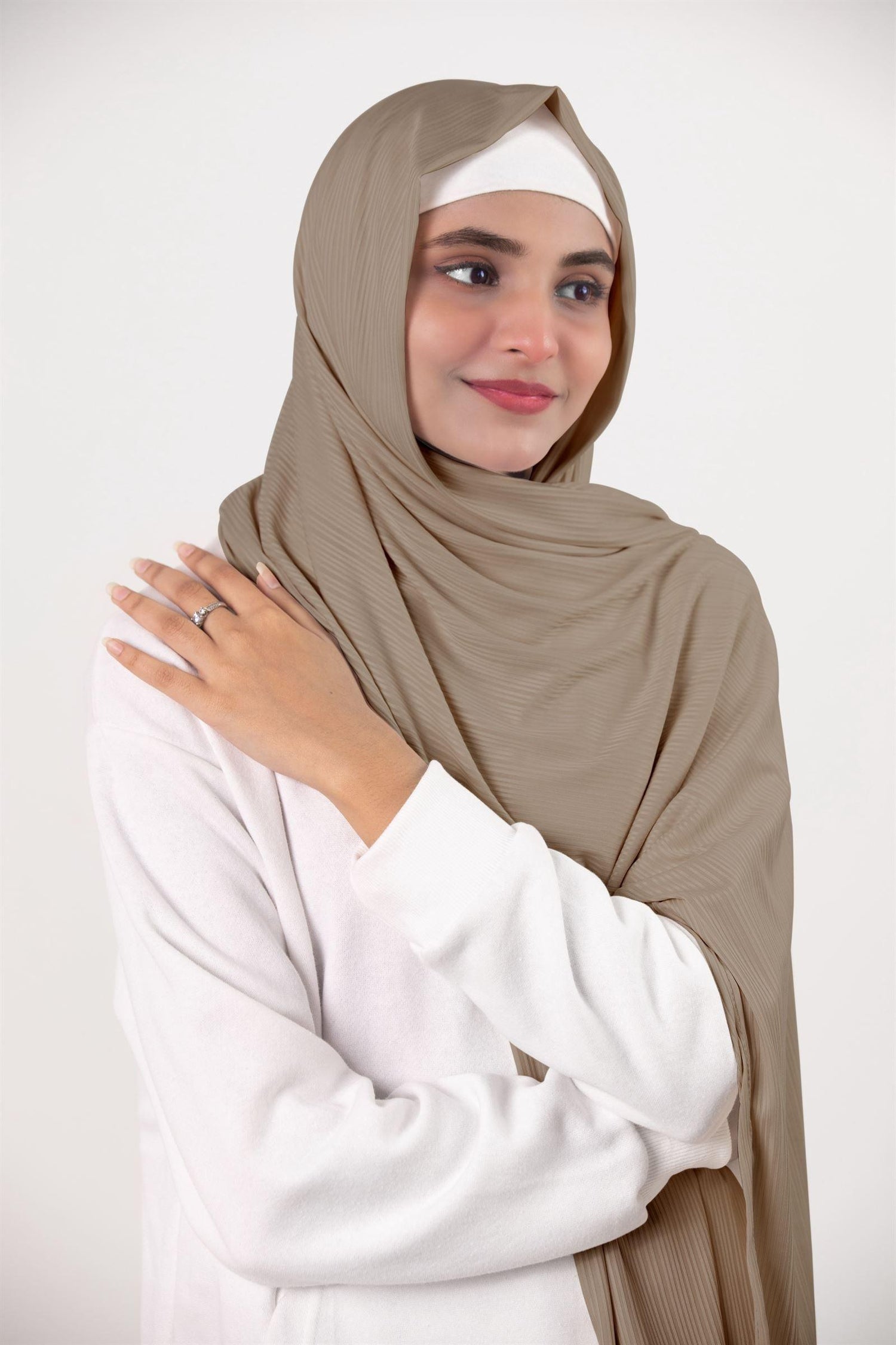 Ribbed Jersey Hijab in Oatmeal. Fashion-forward hijabi draping it for an elegant an chic appearance.