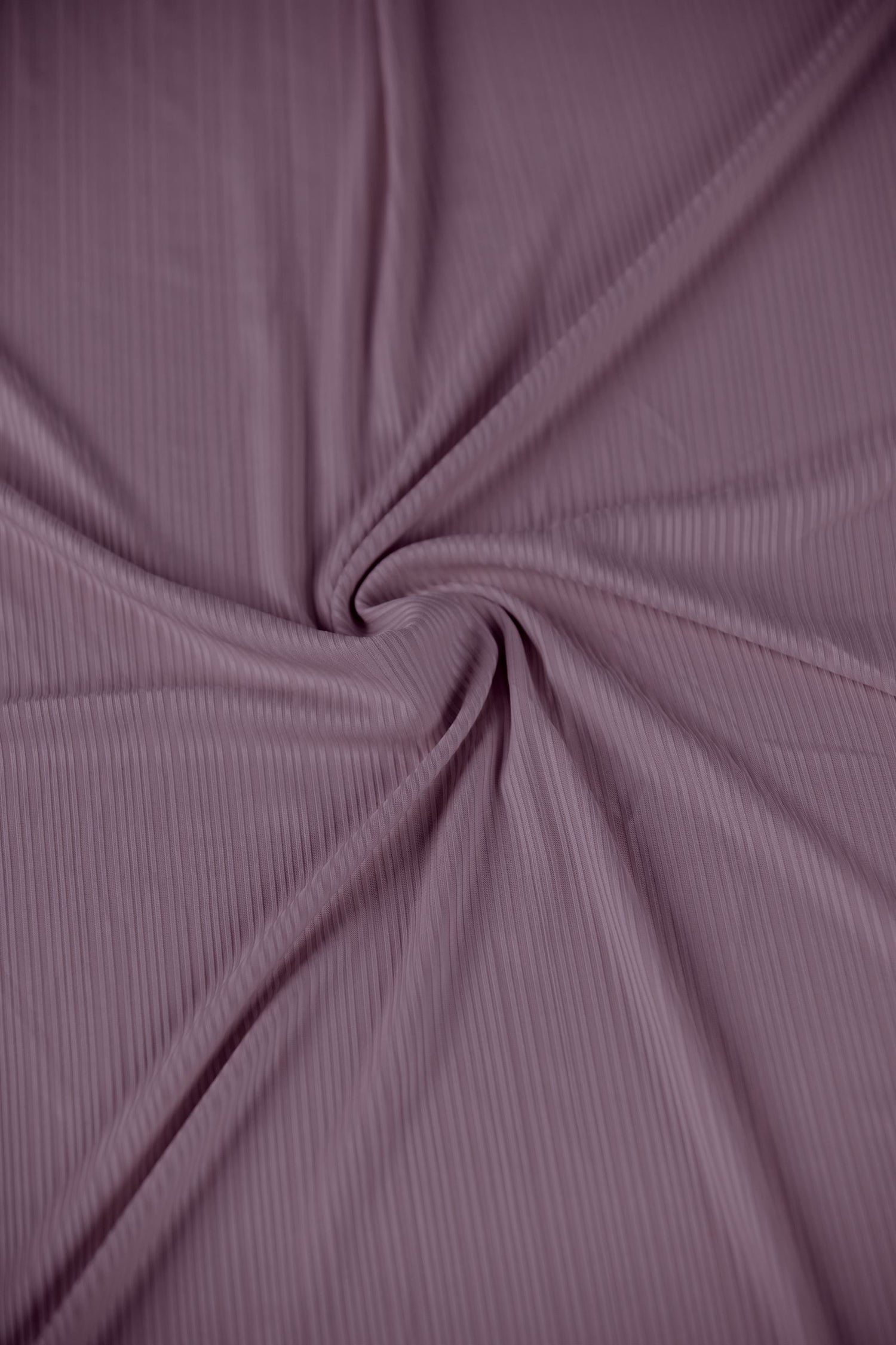 Stylish Ribbed Jersey Hijab in Dusty Pink enhancing an outfit.