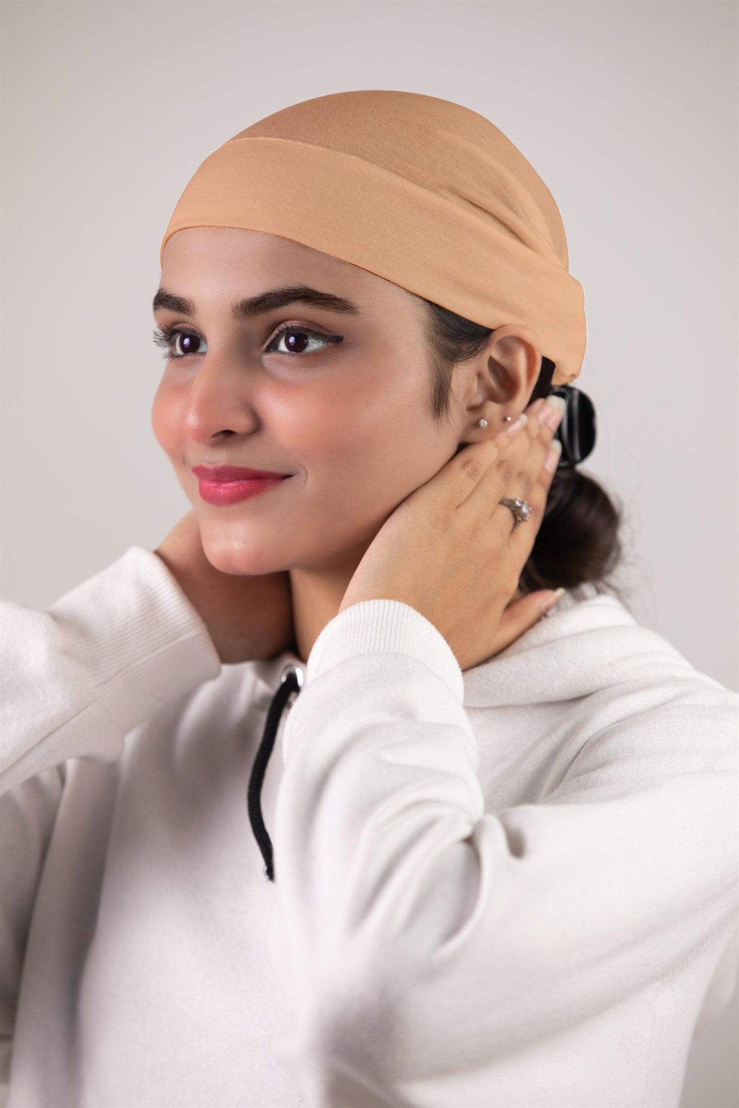 Woman wearing Hijab Cap Soft tube. Nude Color