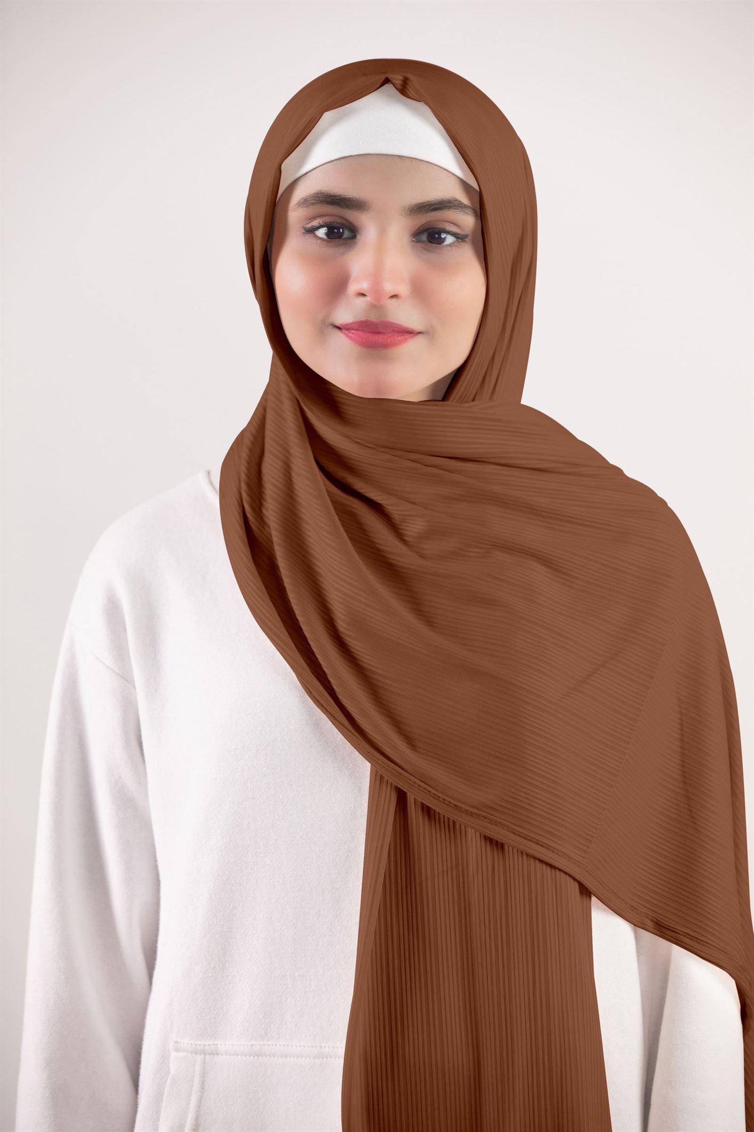 Ribbed Jersey Hijab in Dark Brown. A fashionable look on a chic Individual women wearing it.