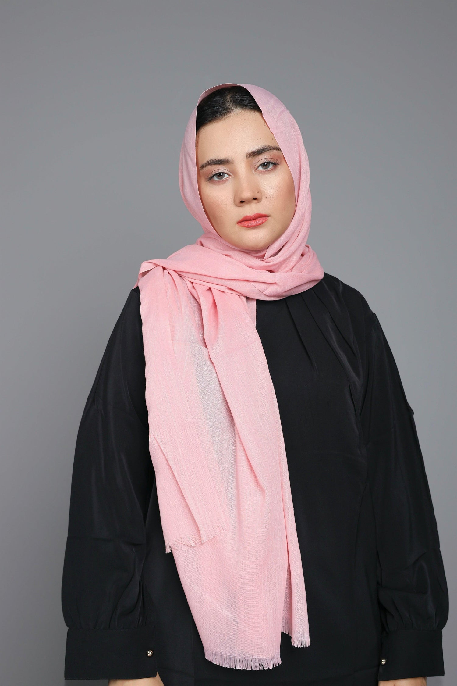 Girl wearing a Vintage Pink Hijab, highlighting its non-slippery feature.
