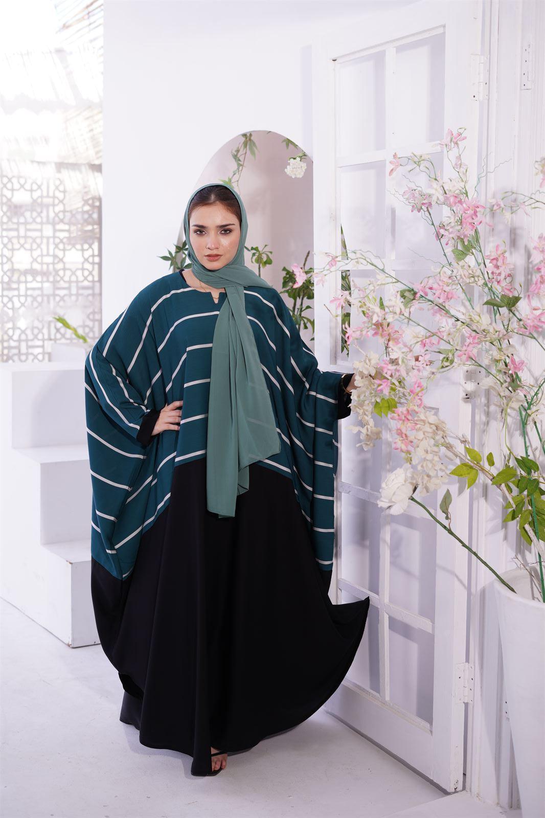 Abayas and Jilbabs. front view of a Girl wearing zoom line Jilbab in sage.