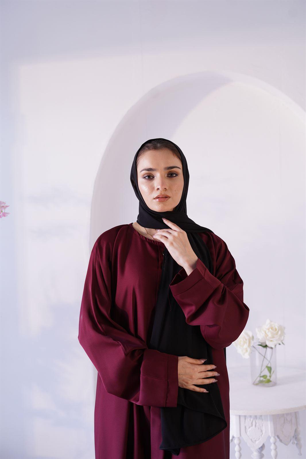 Woman Wearing Amirah abaya in maroon. Buy Luxury abaya Online at hijabandco.