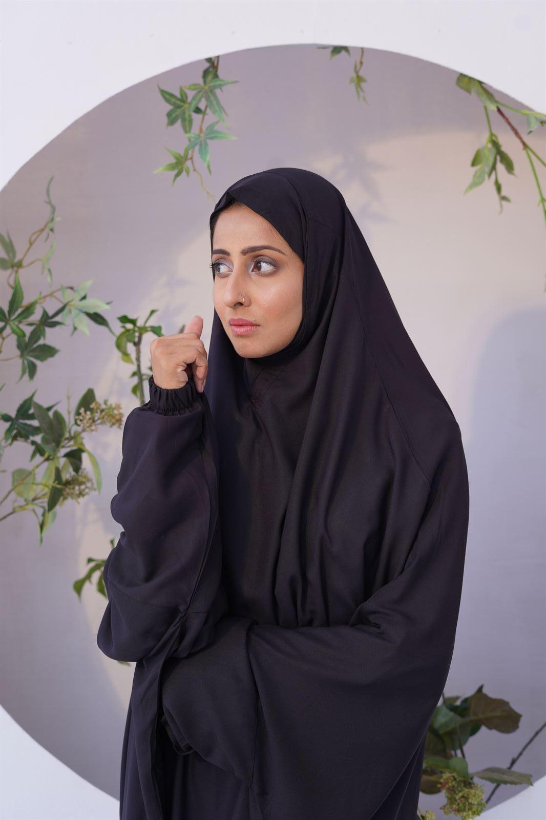 A lady wear namaz chadar with sleeves in black color