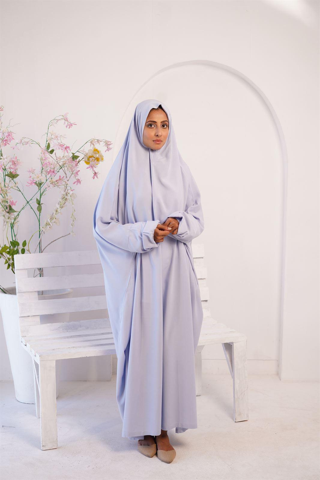 a girl wearing Irani Namaz Chadar in baby blue color