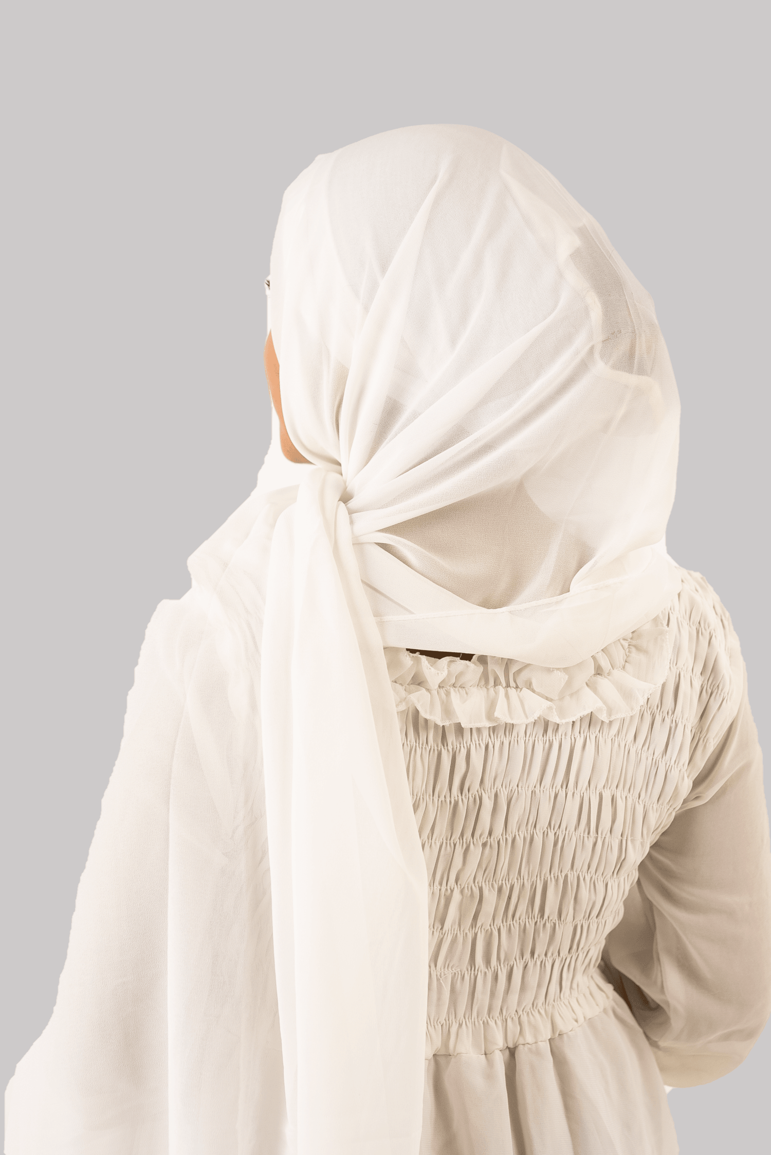 a women wearing instant hijab with cap white color georgette material back side