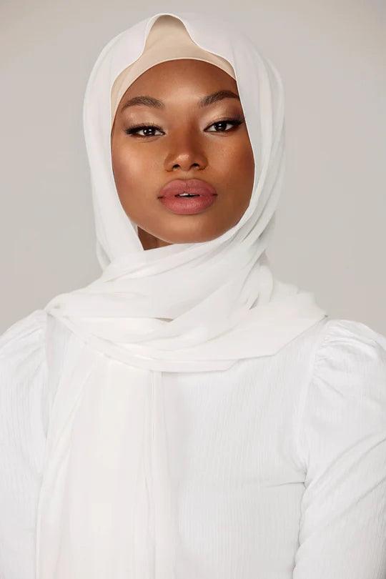 Plain White Georgette Hijab, a girl
styling with white top, looking straight.