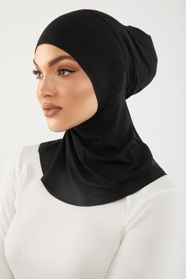 Girl wearing smooth neck cover hijab under cap in black color. Soft Stylish & easy to wear Neck Cover.