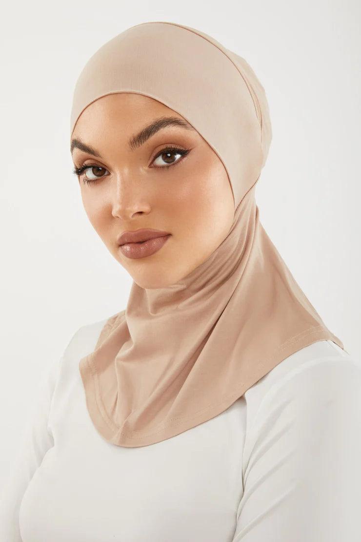 Girl wearing smooth neck cover hijab under cap in nude color. Soft Stylish & easy to wear Neck Cover.