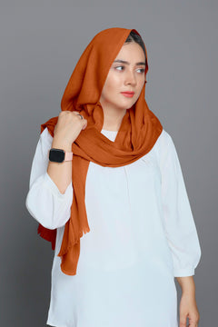 Fashionable lady in a soft Caramel Viscose Hijab, adding sophistication to her outfit.