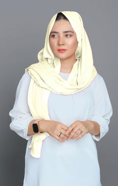 Woman wearing a soft and elegant Turkish Viscose Hijab in Vanilla shade, showcasing a luxurious and comfortable style.