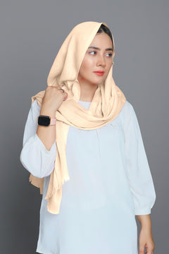 Model styling a Cream Hijab, capturing its elegant look and comfortable fit.
