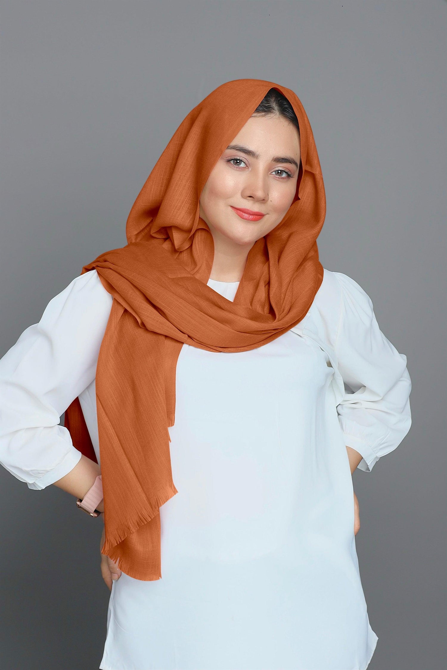 Lady in a Turkish Viscose Hijab in Apricot, perfectly blending comfort and fashion.