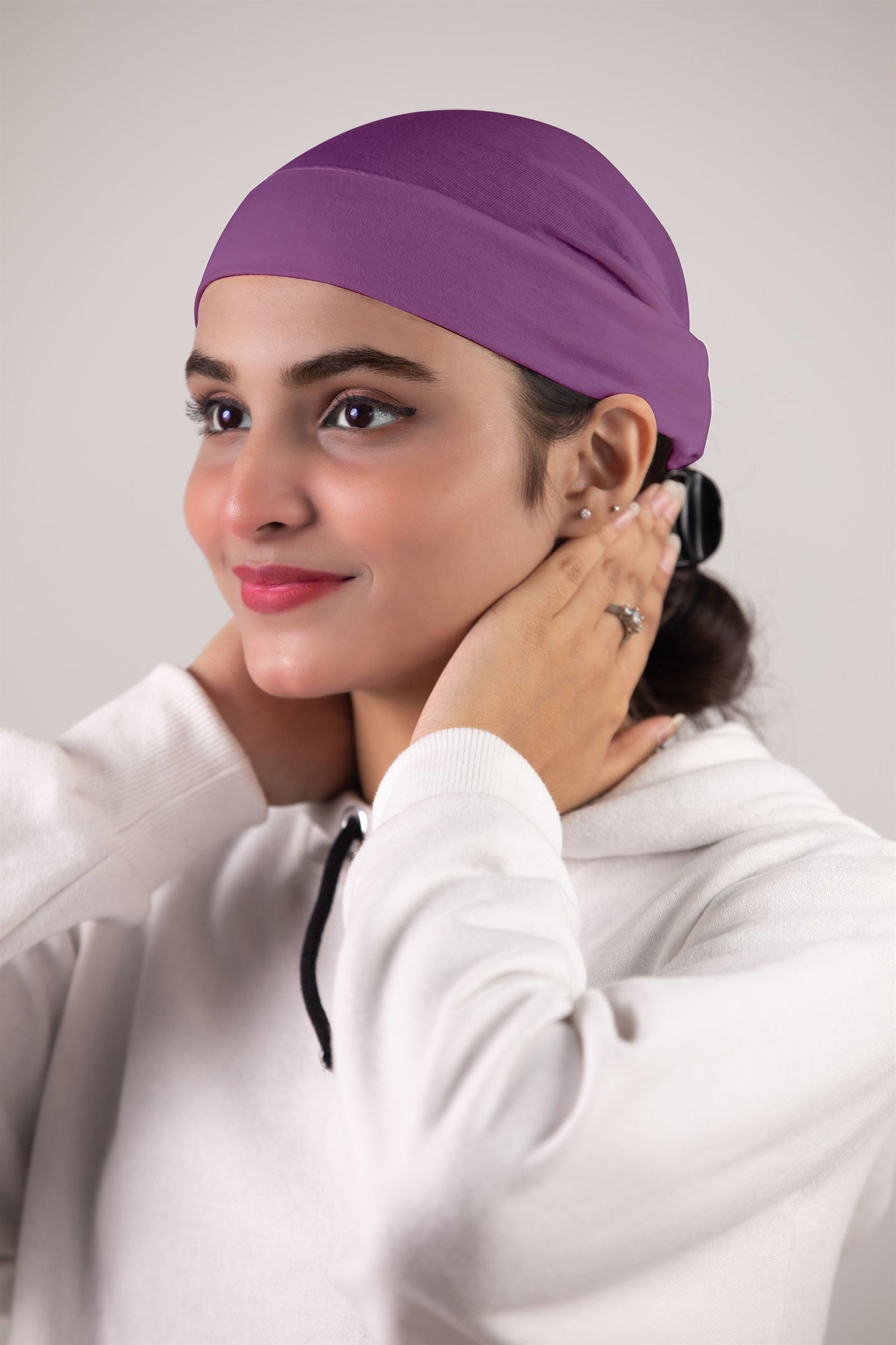 Girl Wearing Soft Tube Hijab Cap in Purple Color, Side Pose. 