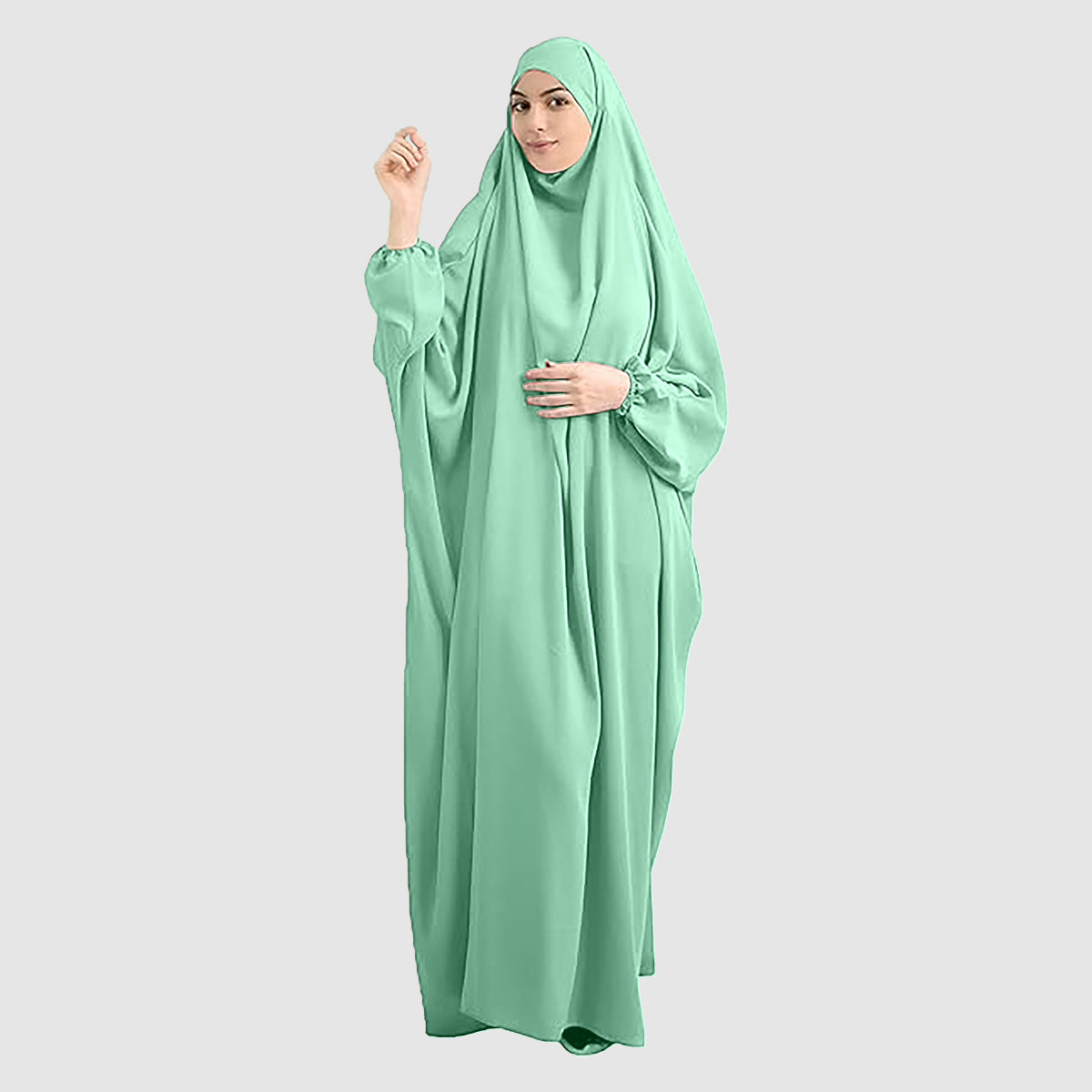 A woman wearing a pure Namaz Chadar with Sleeves in sapphire color, looking straight. Lightweight & Soft Chaddar. Perfect for Salah prayers and every occasion.