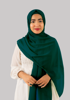 a women wearing instant hijab with cap in teal color, georgette material