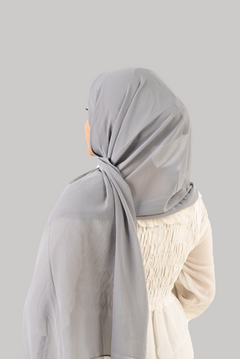 a women wearing instant hijab with cap in grey color georgette material back side