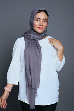 Model wearing a Charcoal Viscose Hijab, showcasing its chic look and comfortable fit.