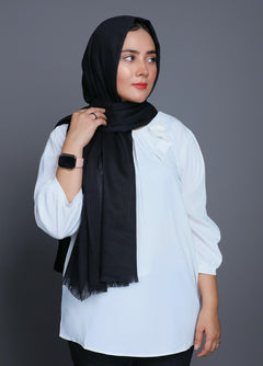 A women wearing Turkish Hijab, viscose fabric, Black color, with white top looking her left