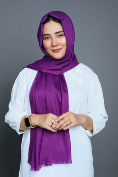 A woman wearing a luxurious Royal Purple Turkish Hijab, showcasing elegance and style. Premium Viscose Cotton Fabric.