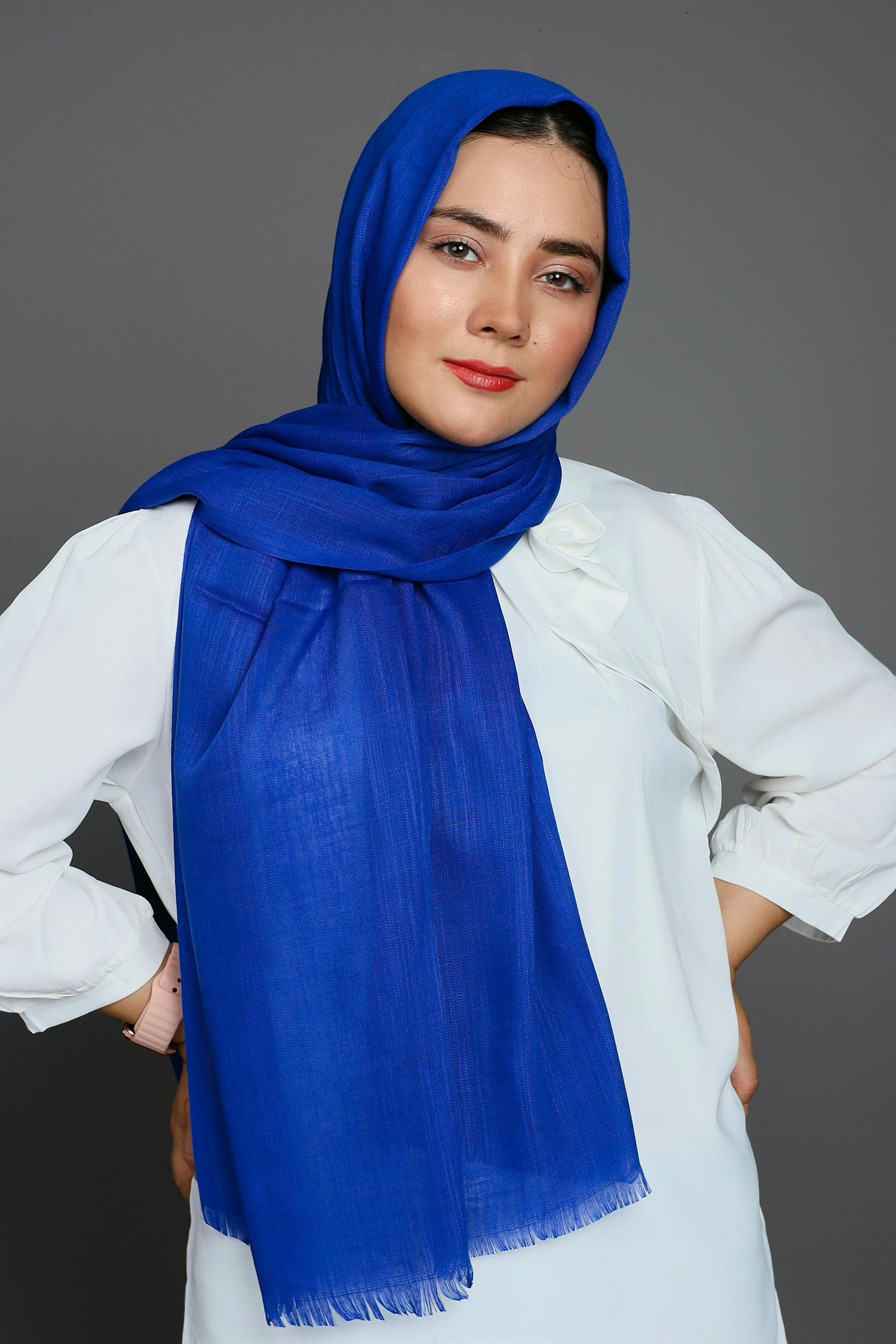 Woman wearing an Ink Blue Turkish Viscose Hijab, radiating elegance and style.