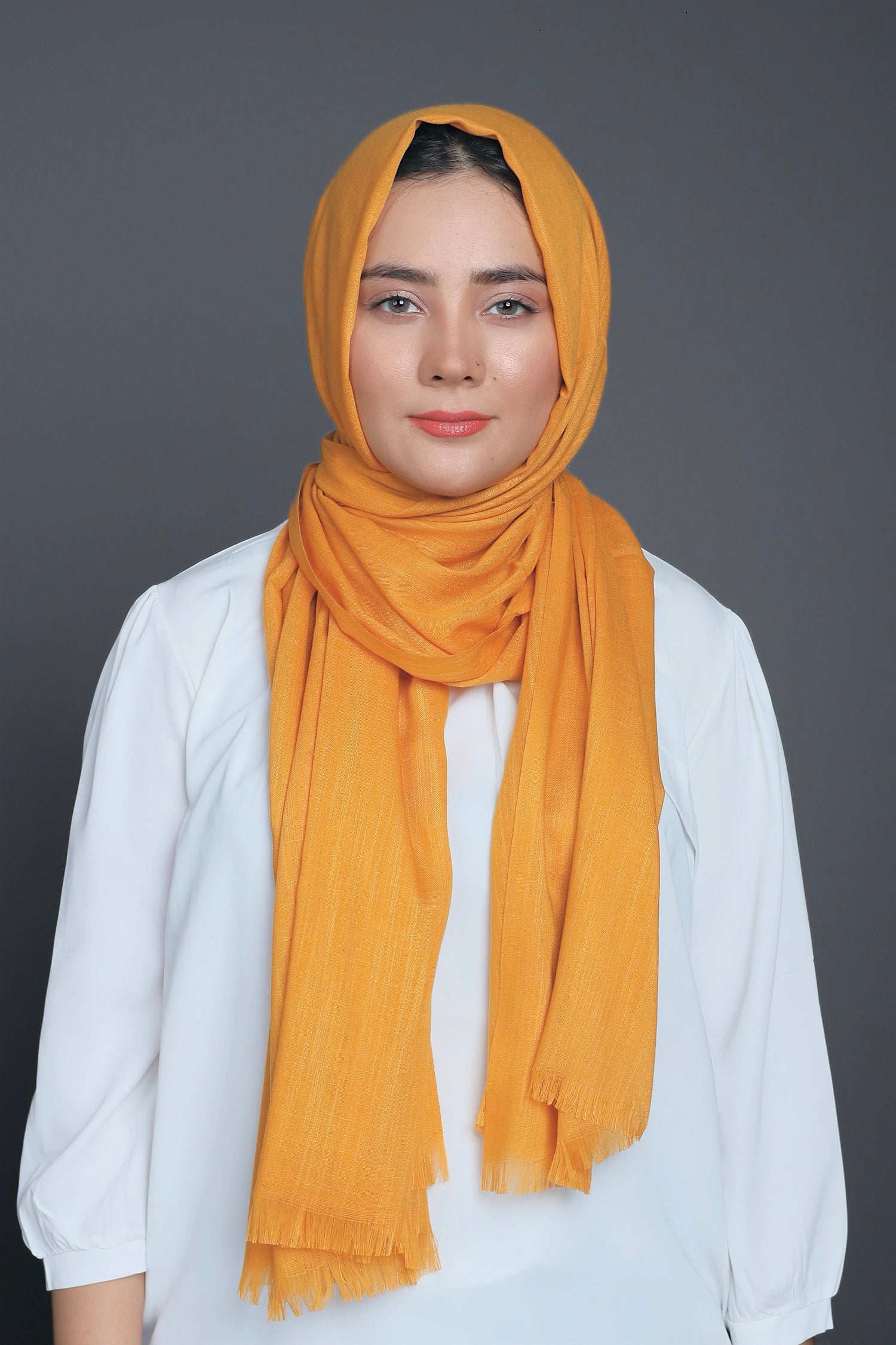 Close-up of Mustard Cotton Viscose Hijab, emphasizing its vibrant color and soft texture.