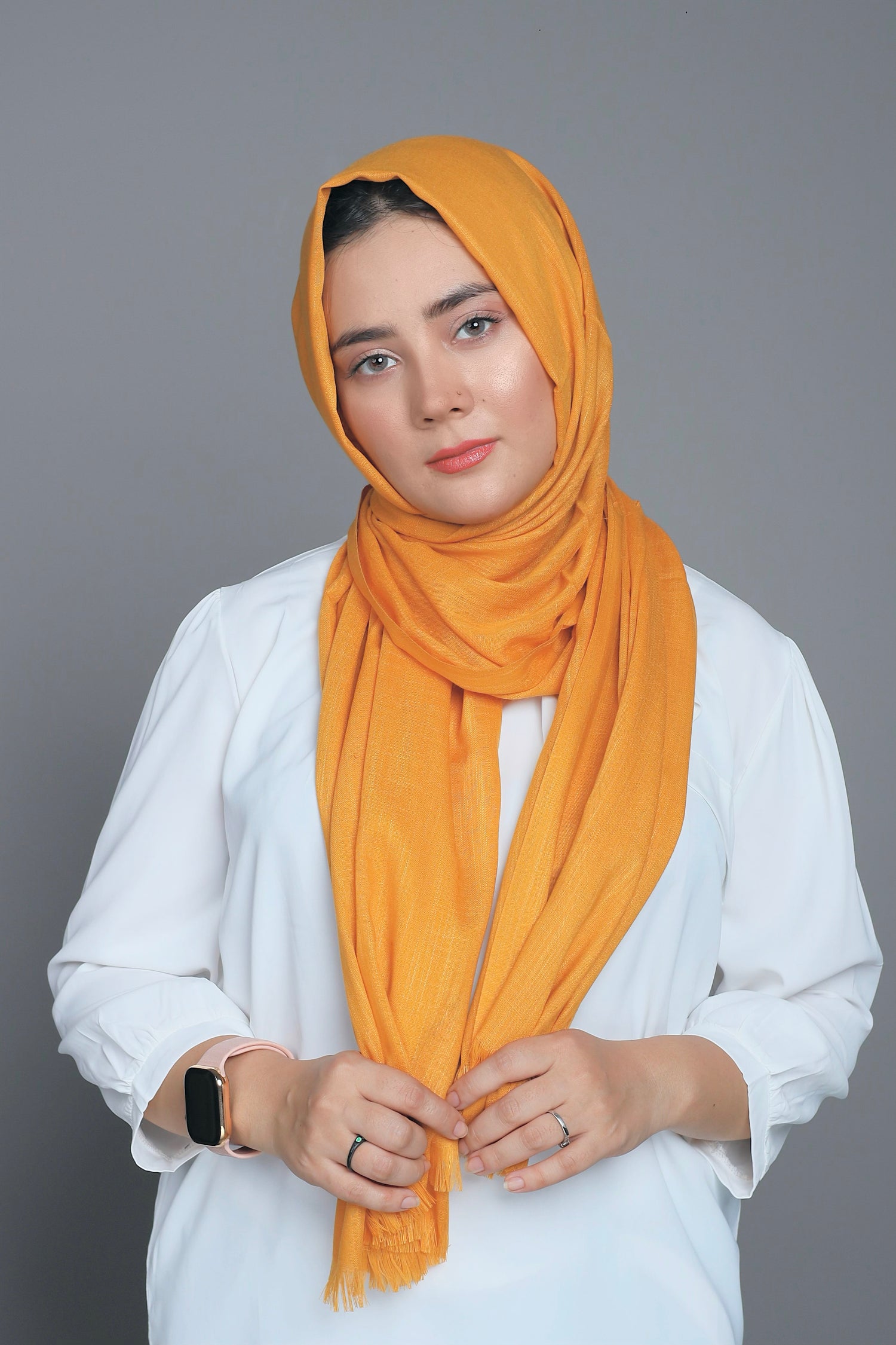 Mustard Turkish Hijab elegantly displayed, illustrating its versatility and fashionable appeal. Premium Cotton Viscose.