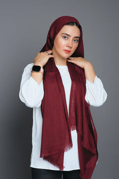 girl wearing Turkish Hijab, viscose fabric, in burgundy colour, on white top looking straight