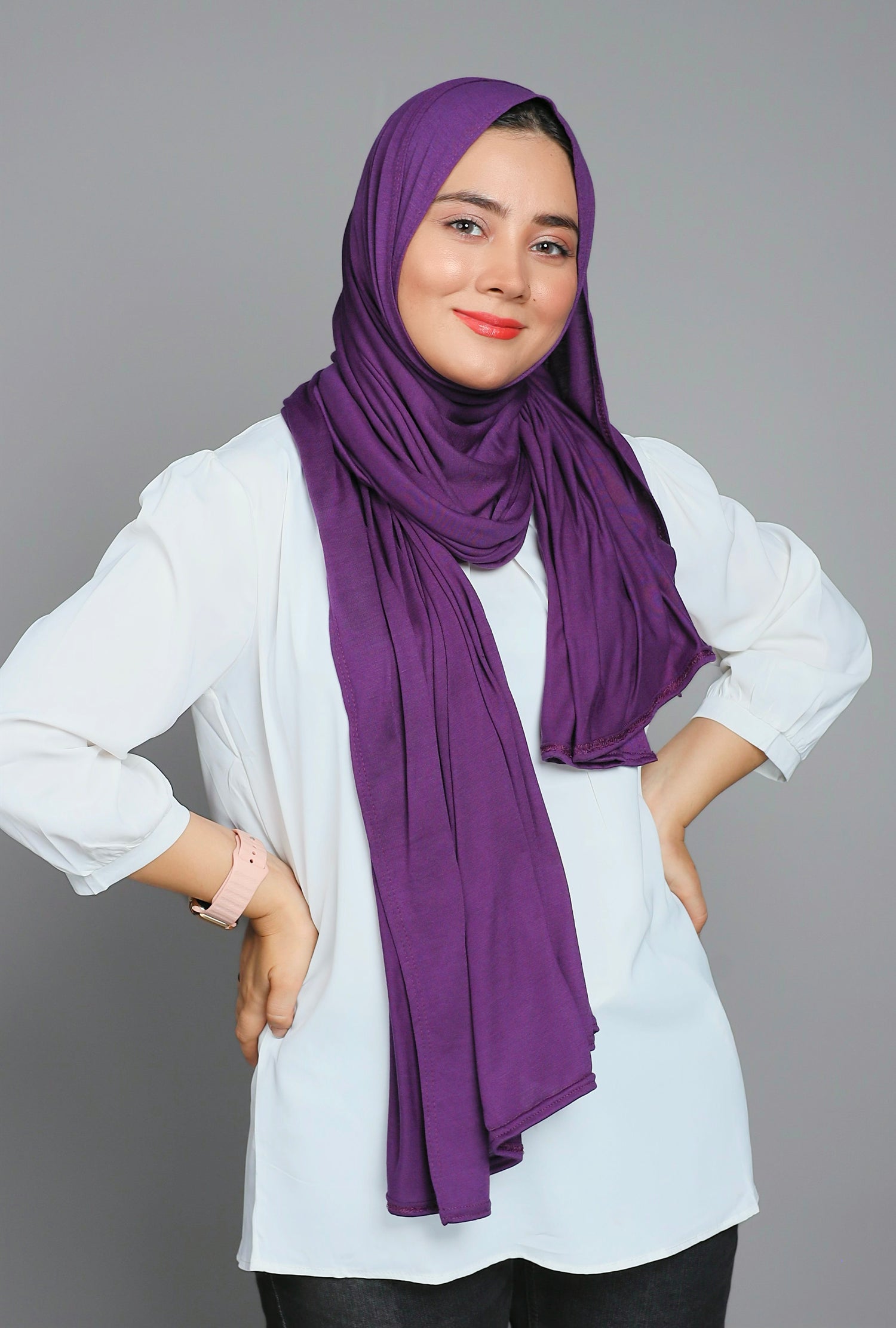 Chic woman in a Violet Jersey Hijab. Showcasing her elegant fashion sense.