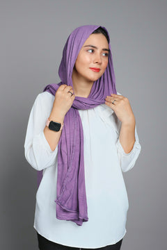 jersey Hijab in purple. Woman Wearing and looking her right.