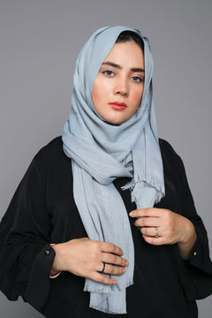 Woman styling a Steel Grey Turkish Hijab, capturing its chic look and lightweight feel. Viscose Fabric Material.