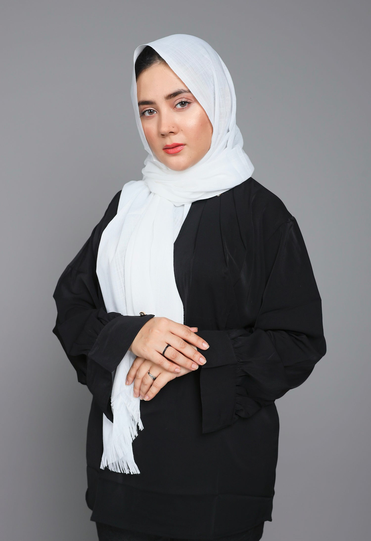 Turkish Scarf Hijab in Pure White shade, folded neatly to display its light to medium thickness. White Turkish Hijab. 