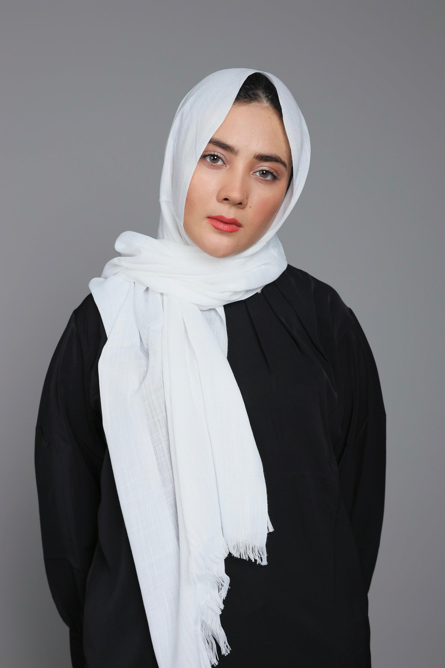 Woman wearing Turkish Hijab, in Pure White elegant styled.