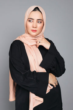 Brown color Jersey Hijab. Chic Girl styling in Jersey Hijab looking right.