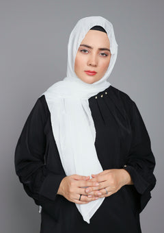 Elegant hijabi draping in Metallic Chiffon Hijab in Pure White color. over black top.