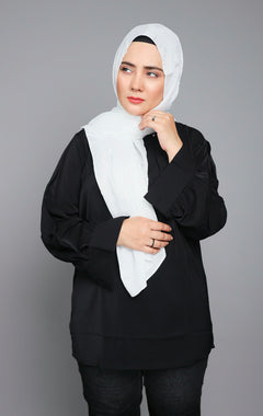 Metallic Chiffon Hijab in stunning Pure White color. Woman styling it over black top.