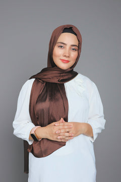 Elegant Girl draped in Metallic Chiffon Hijab in dark brown color. over white top.