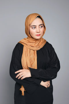 woman wearing almond colored Jersey Hijab.