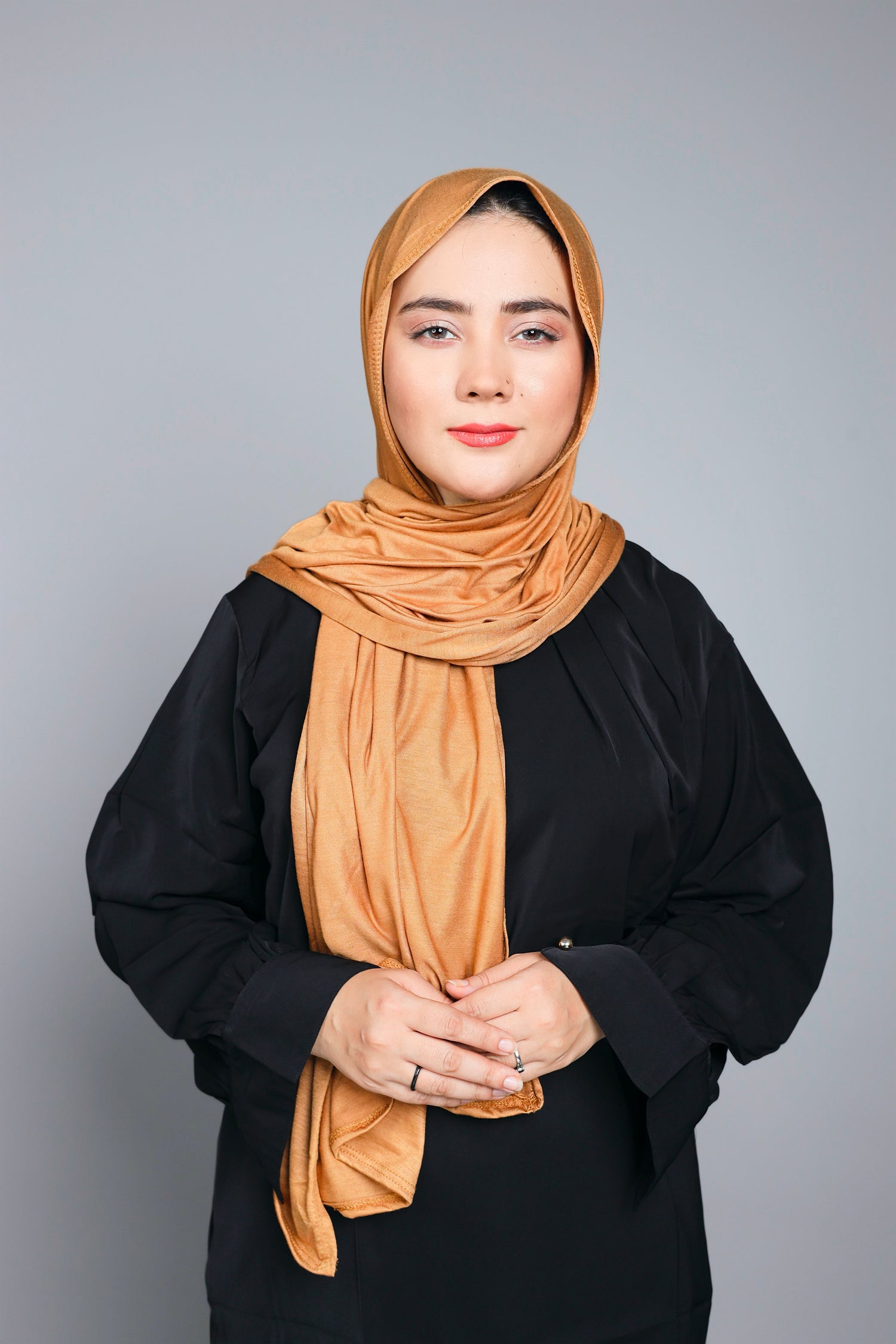 Woman wearing Almond color Luxurious jersey Hijab.