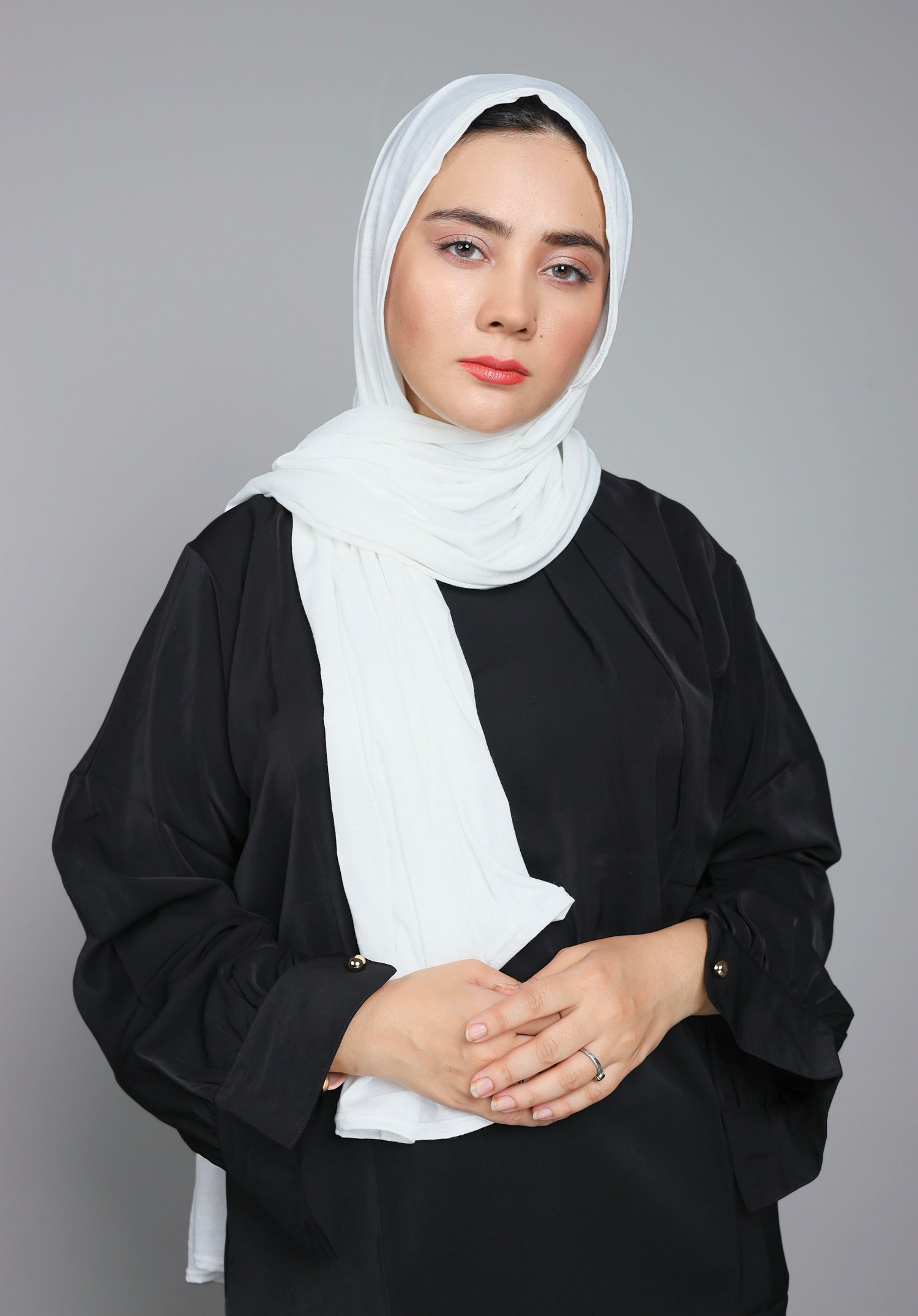 Woman wearing white colored Jersey Hijab. Elegant & Premium Jersey.