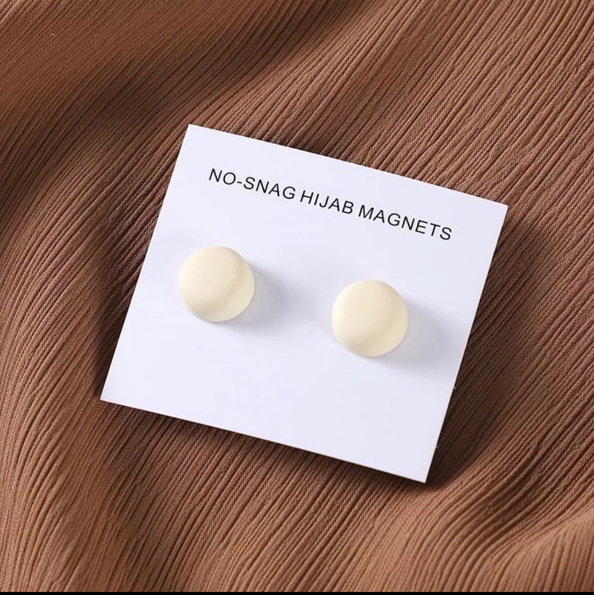 Matte Hijab Magnets in a chic circle White design, providing a stylish and secure alternative to traditional pins while protecting delicate hijab fabric.