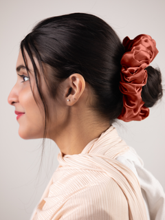 Girl wearing Rust Silk Scrunchie. Cool & Stylish Hair Accessory.